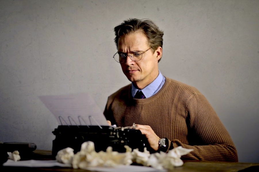 Man writing a paper