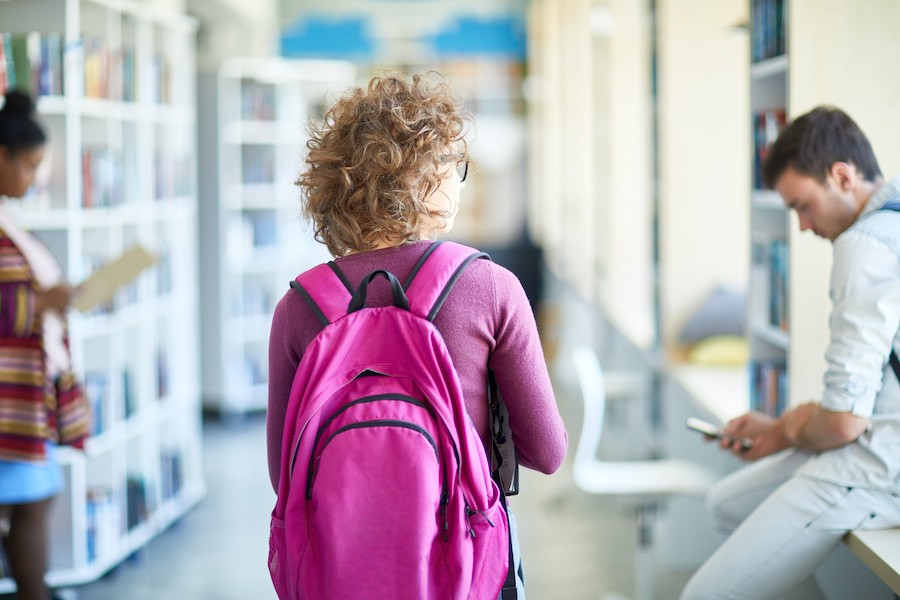 Woman with Backpack going to school