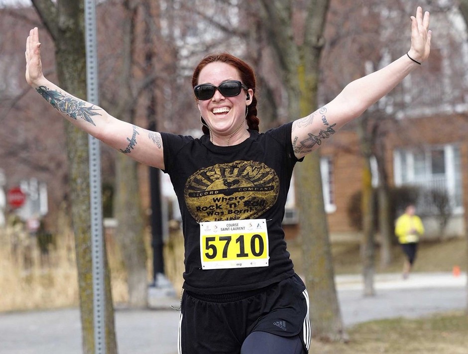 Woman running with arms outstretched