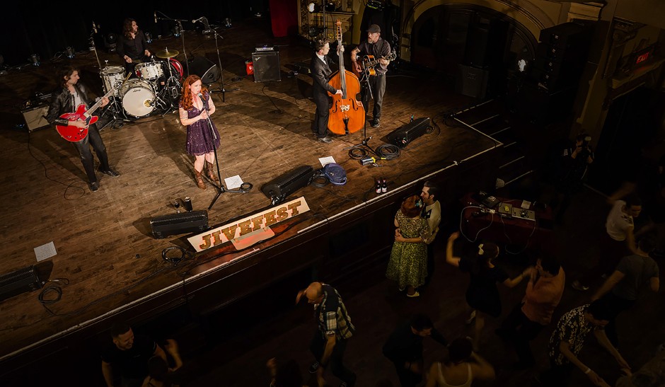 Band on stage at Rialto, purple dress, dancers