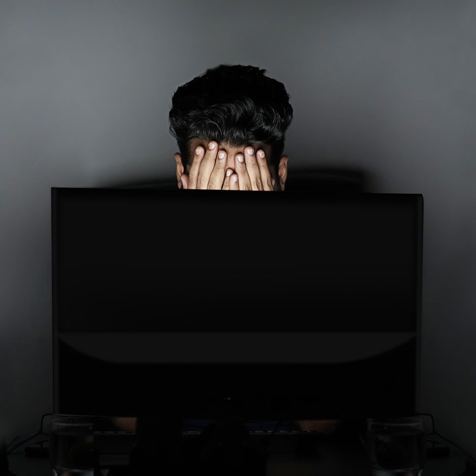 Discouraged man in front of a computer