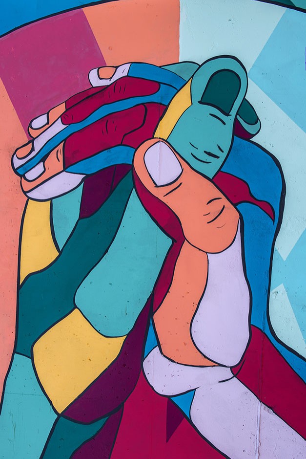 Mural of colourful hands holding each other