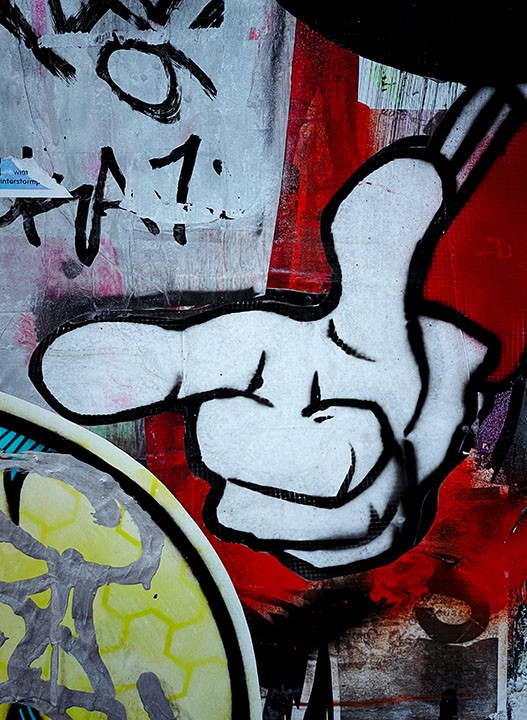A graffiti of a pointing hand