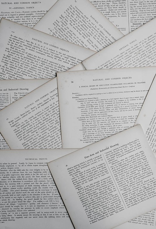 Scientific papers scattered on a table. 