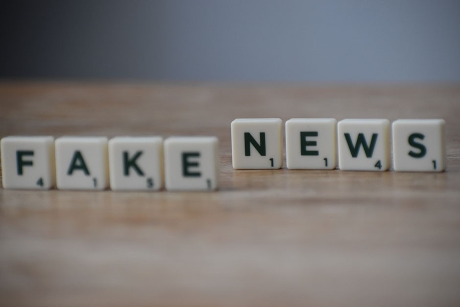 Boardgame letter tiles arranged to say Fake News