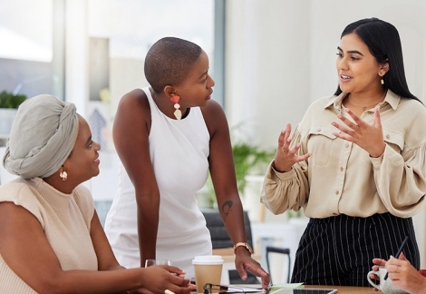 Diverse group of young women brainstorming