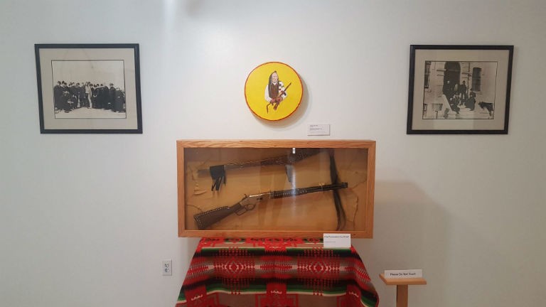 Chief Poundmaker's gun and staff.