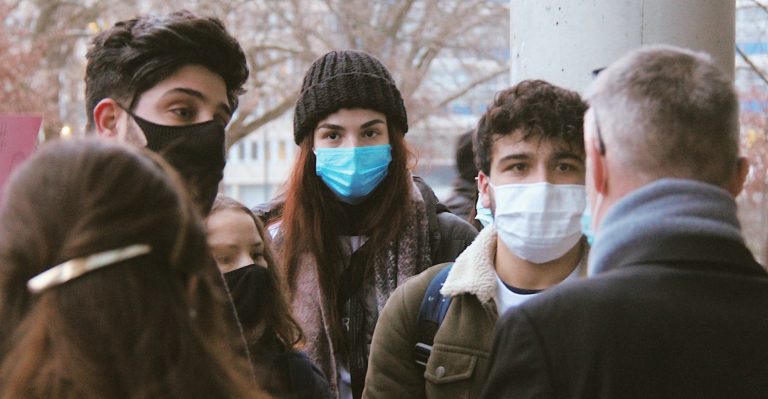 Crowd of students wearing medical masks