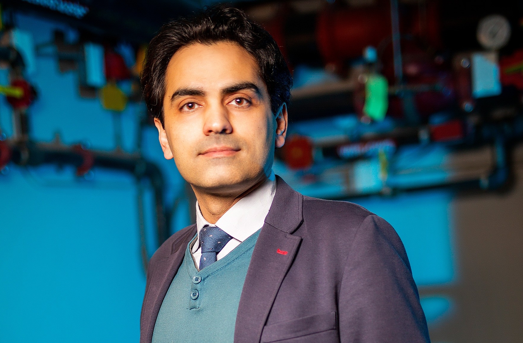 Fuzhan Nasiri Fuzhan Nasiri wears a purple jacket and blue sweater