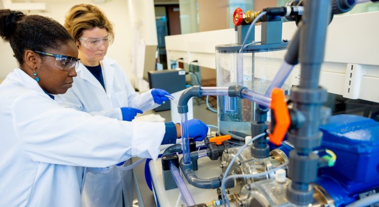 Two women working in a chemical lab
