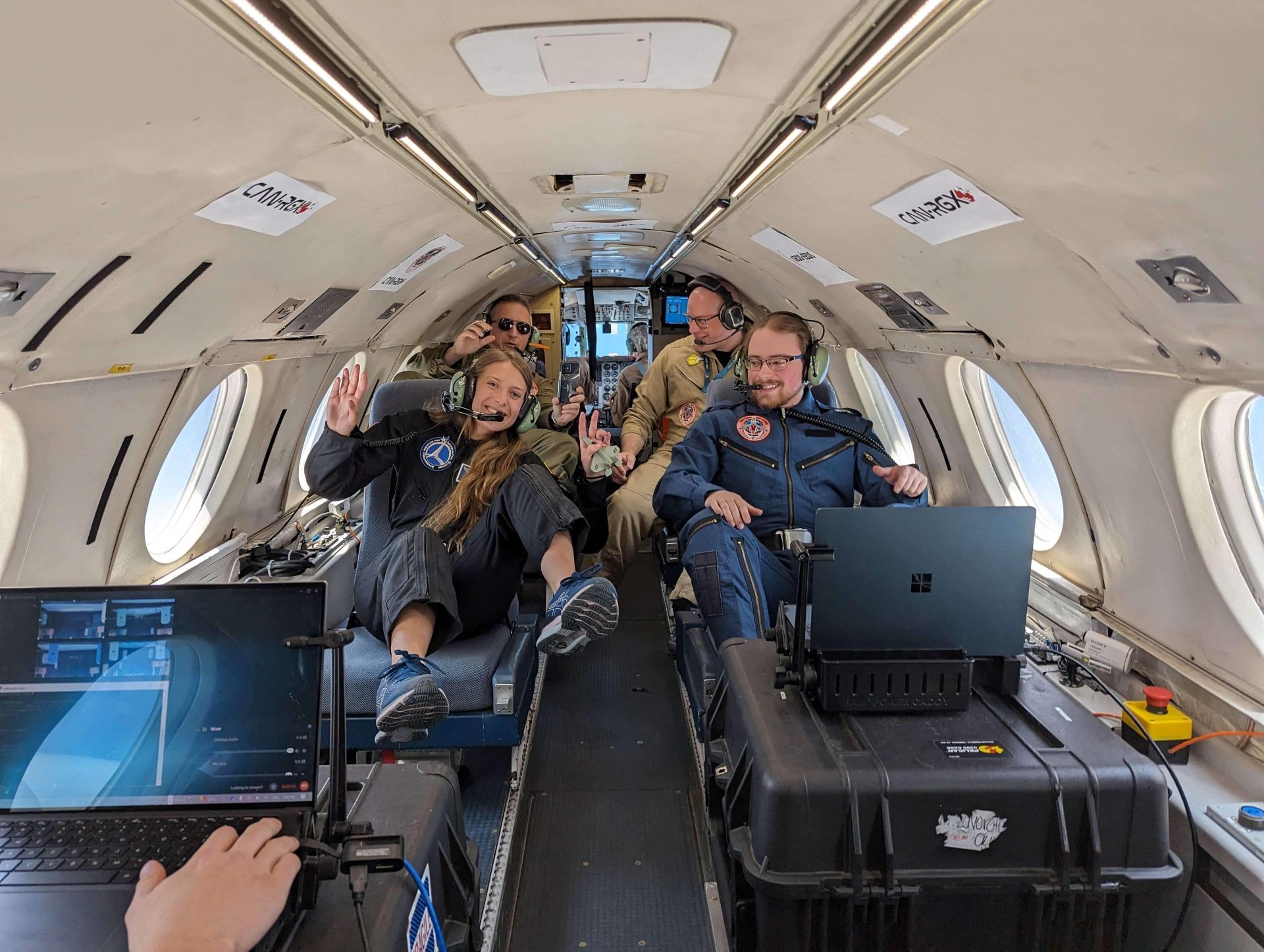 Researchers in a hypogravity airplane