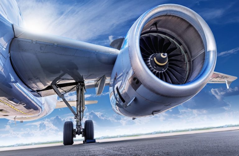Focus on an aircraft engine of a plane on the tarmac