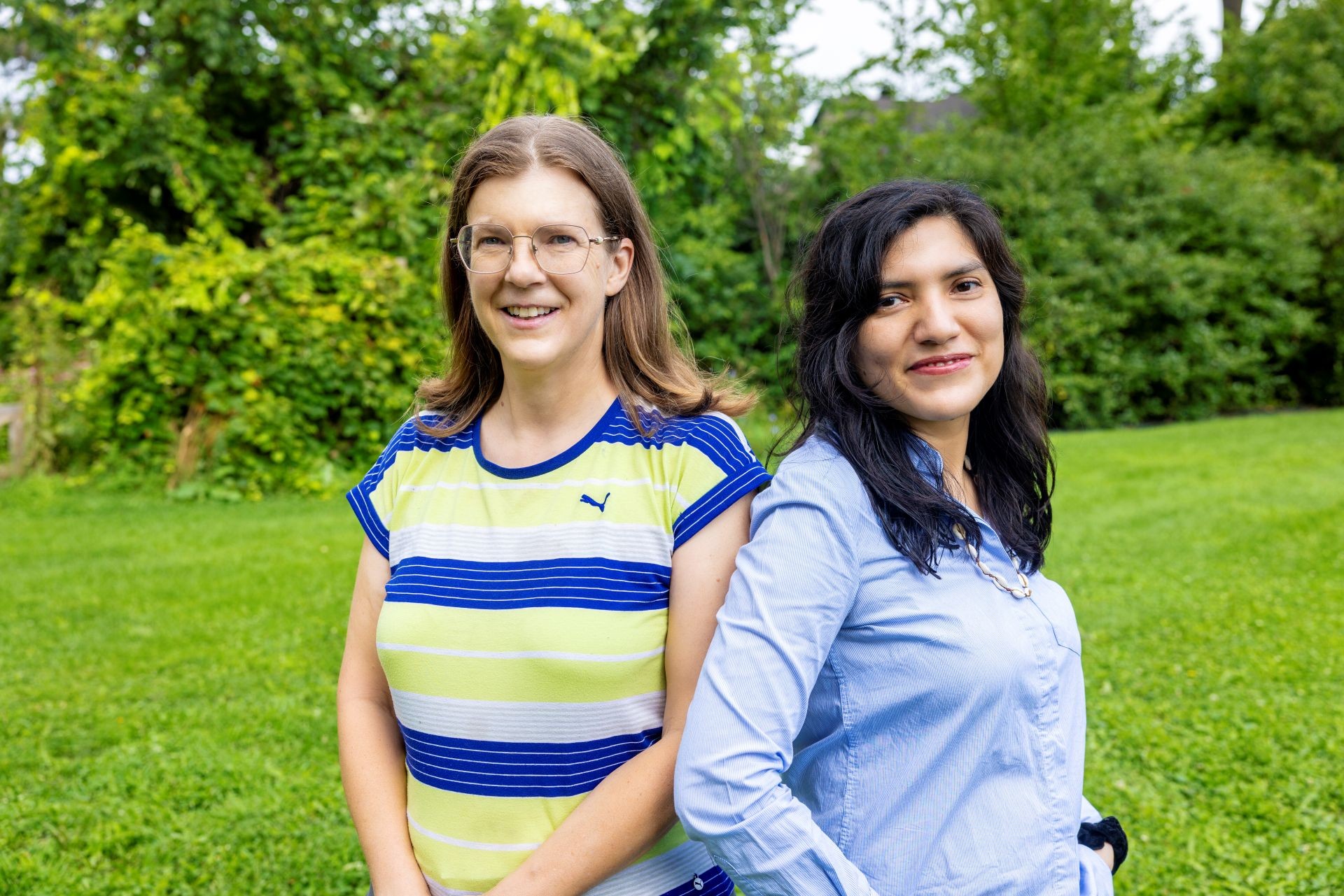 Two female researchers standing in a field