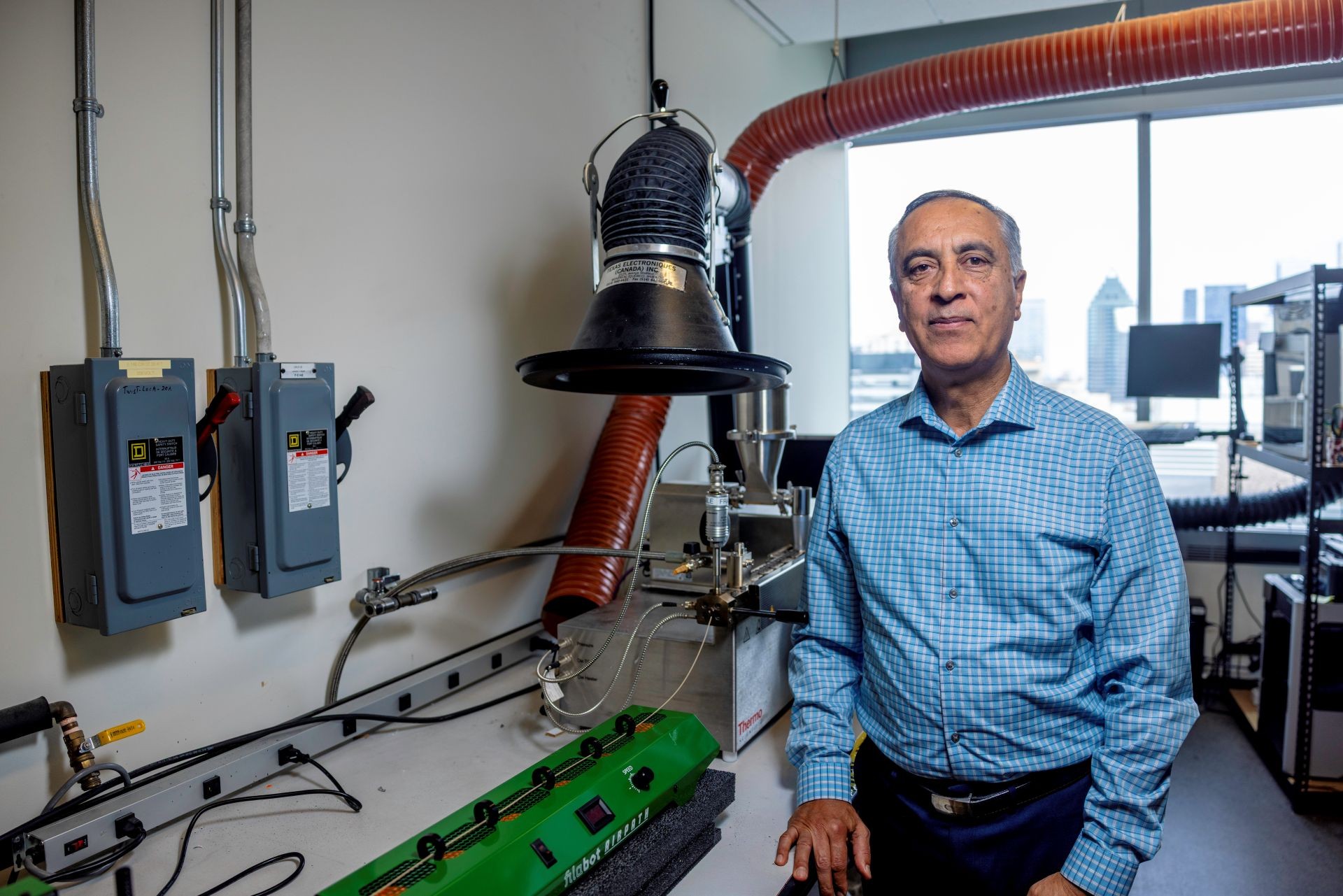A man in a blue shirt in a lab