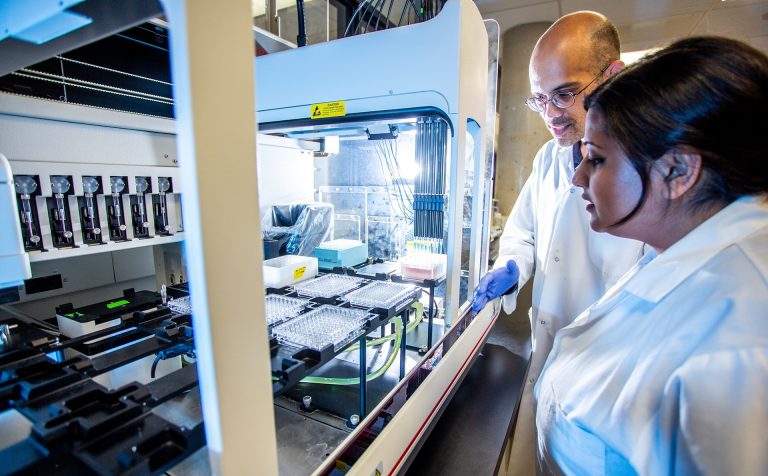 Woman in a white lab coat in a university laboratory