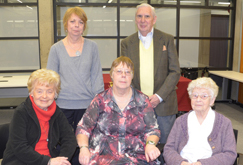 Robertson (centre), seated between her aunt (at left) and mother (at right), with her sister and uncle in the back. | Photo by Concordia University