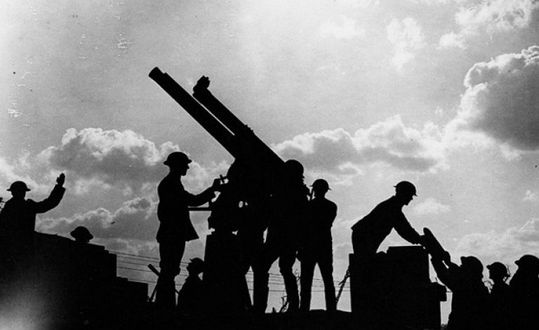 Anti-aircraft gun in action during the battle. (Silhouette taken near Frezenberg). | Photo courtesy of National Library of Scotland, via Wikimedia Commons