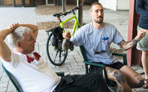 Uffe Elbaek (left) with student Jesse Massumi during a discussion at the Expo 67 site.