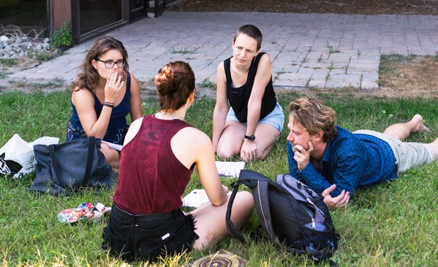 Students engaged in group discussions with Mark Beanland from the Danish political party, The Alternative.