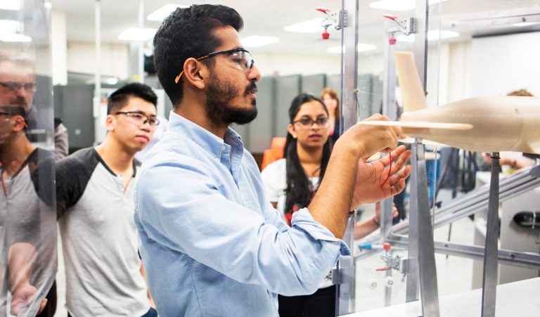 Reuben Warnongbri (centre): “This apprenticeship has equipped me with the most up-to-date and in-demand skills in the industry.” | Photo by Leslie Schachter