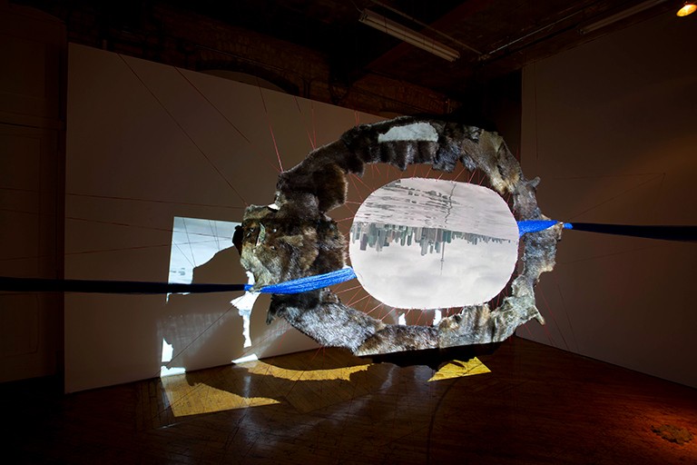 Mishtamishk, by Sonia Robertson, 2018. Artwork of an image of an upside-down city.
