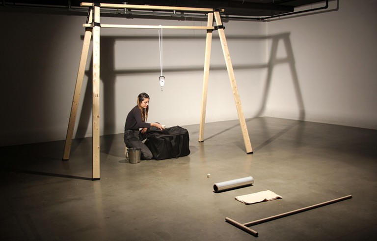 Intermedia student Marissa Sean Cruz’s “PLAY(ing in my) PEN(ding doom),” 2019, a collision of performance and computer-generated animations. | Courtesy of the artist Young woman in an artist studio