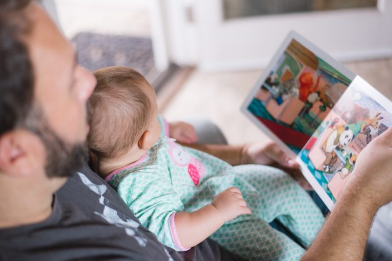 Man reading to baby