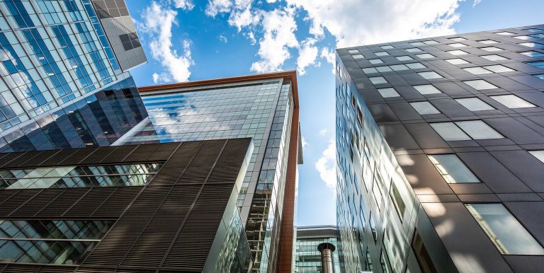 Shot of city buildings taken from below.