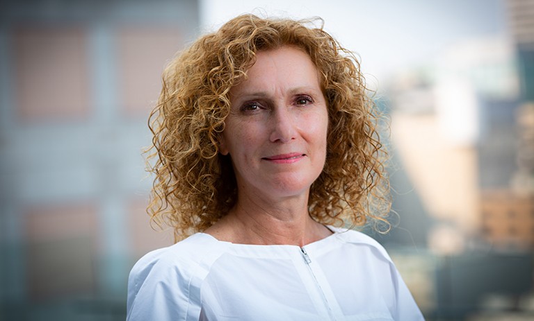 Carmela Cucuzzella: “Identifying and conceptualizing specific SDG targets was a key part of our system-modelling exercise.” Smiling woman with long, curly red hair and a white shirt.