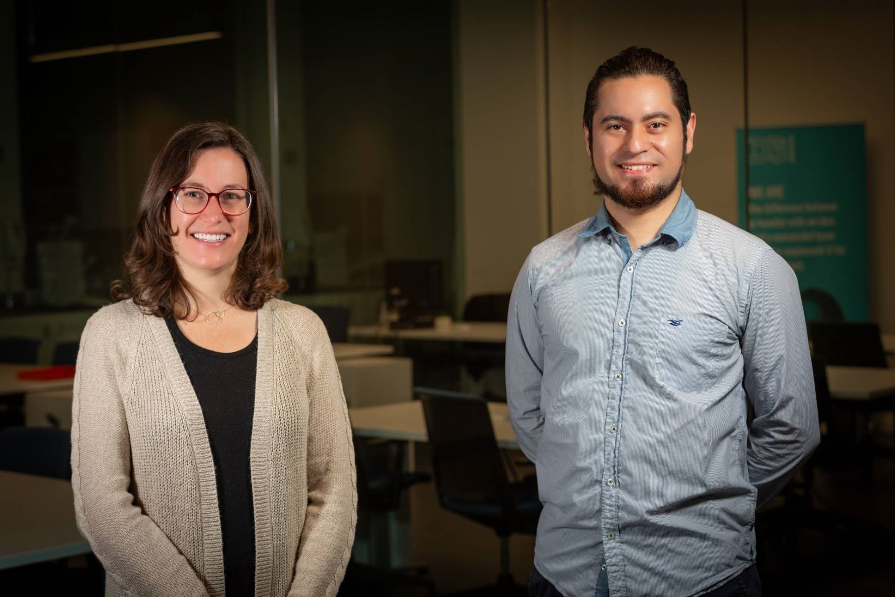 Ashlee Howarth and Victor Quezada-Novoa Ashlee Howarth on left and Victor Quezada-Novoa standing in a classroom
