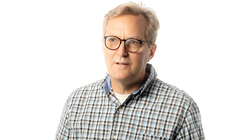 Peter Graham | Photo by David Ward Image of a middle-aged man with short, blonde hair, in a checkered shirt and in the process of saying something