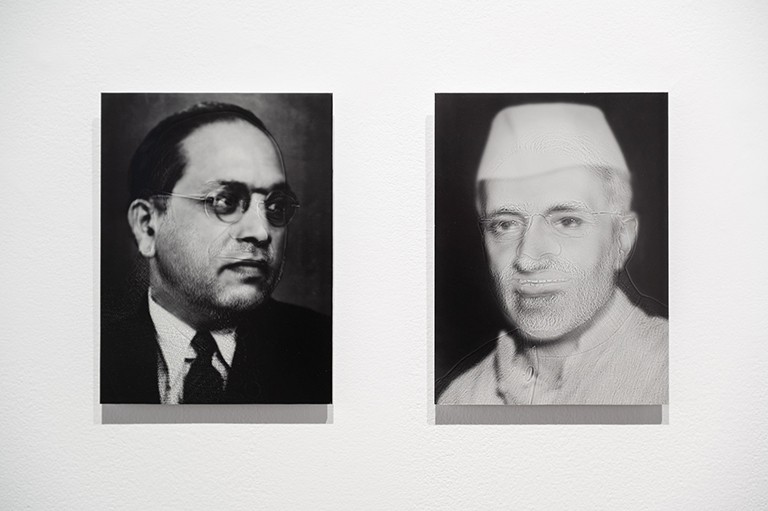 Scramble by Sohrab Hura, 2020. | Photo by Paul Litherland Photographs set side by side of one man with short dark hair and glasses and one man with a white hat and white tunic.