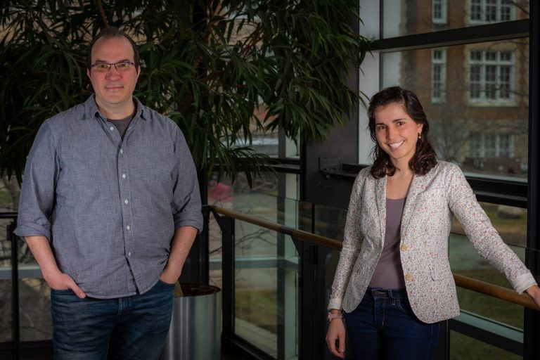 Pedro Peres-Neto and Carly Ziter standing inside