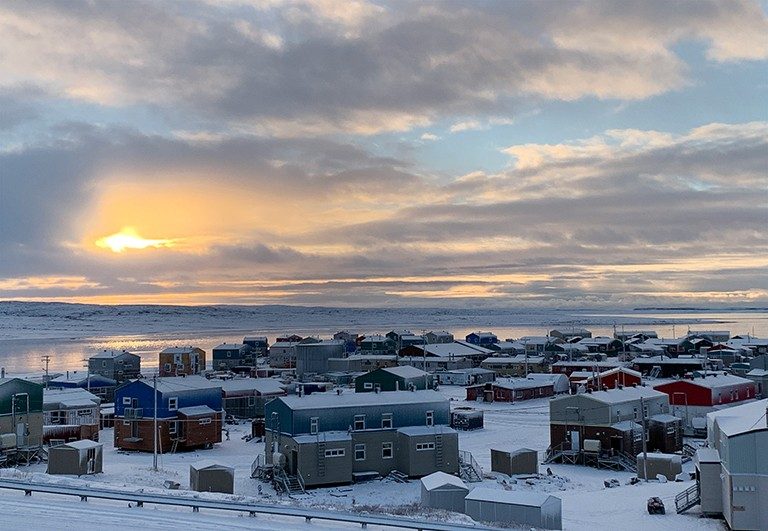 Sunrise over an arctic settlement.