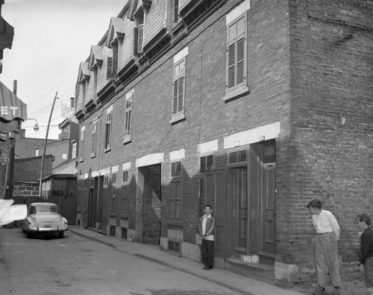 Boy posing on street, 1957