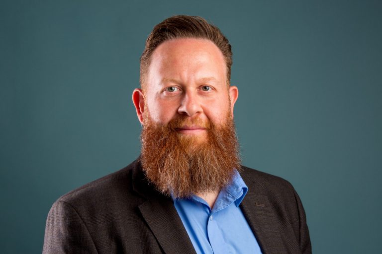 Portrait of man with auburn hair and beard