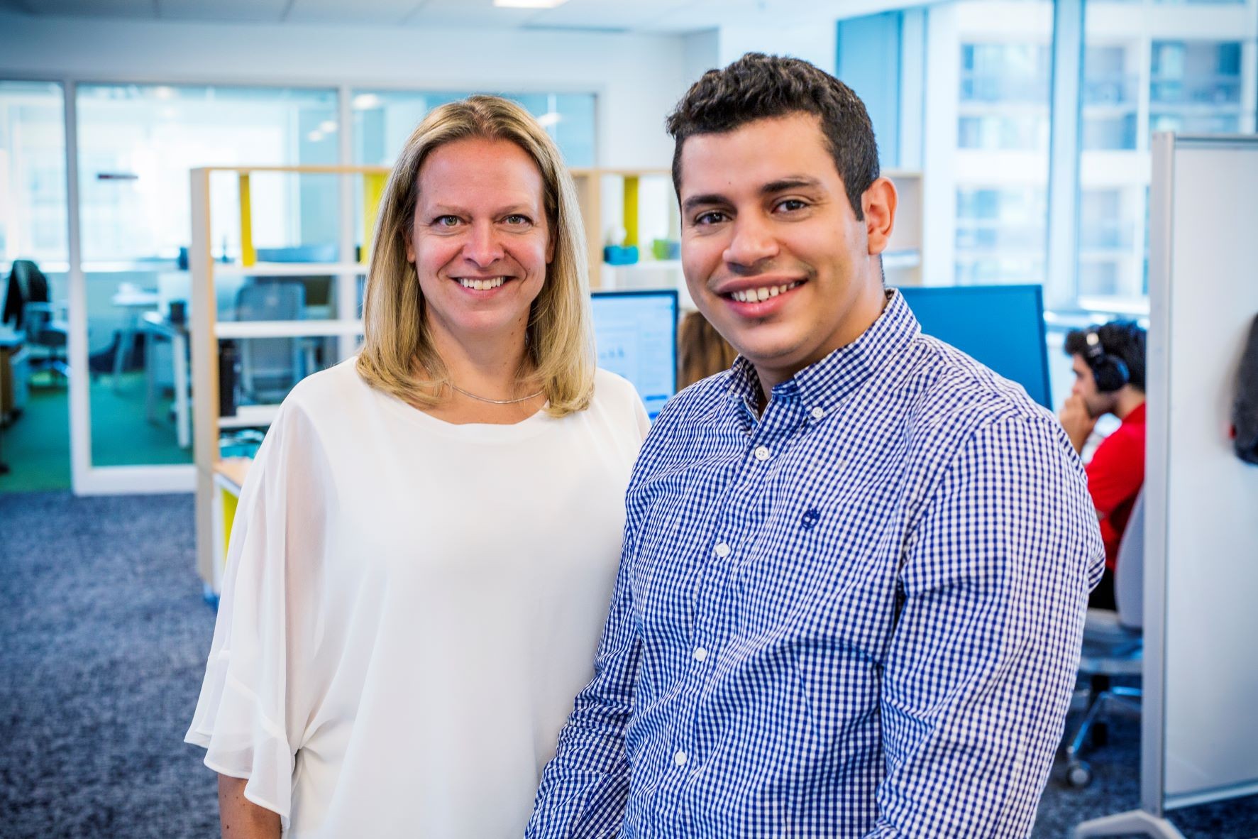 Natalie Voland and Mostafa Saad inside an office