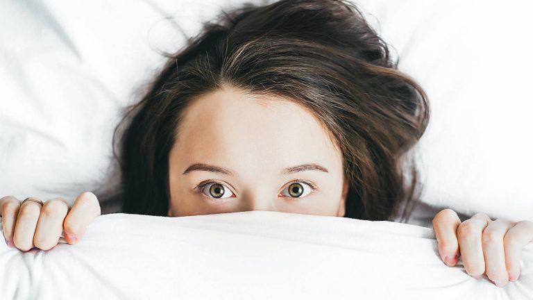 Woman awake in bed