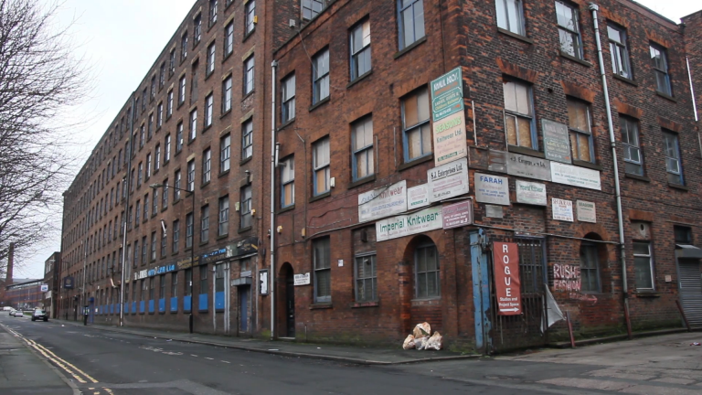 Orange brick building in a Manchester industrial neighbourhood