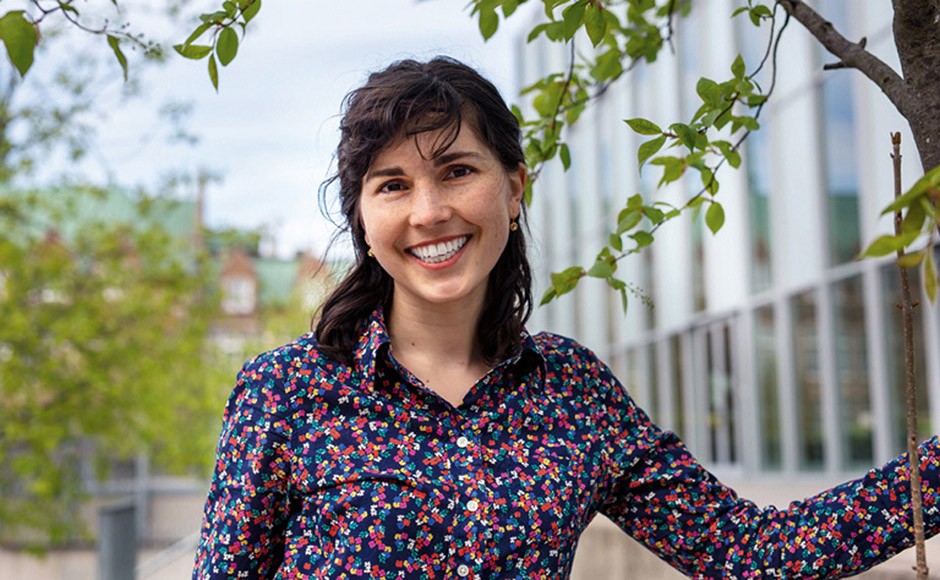 Portrait of Carly Ziter, outside wearing colourful blouse