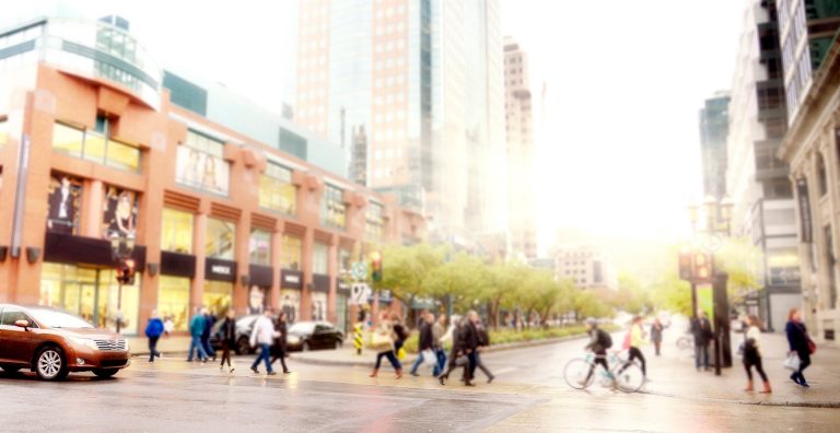 An artistically blurred image of people on a city street.