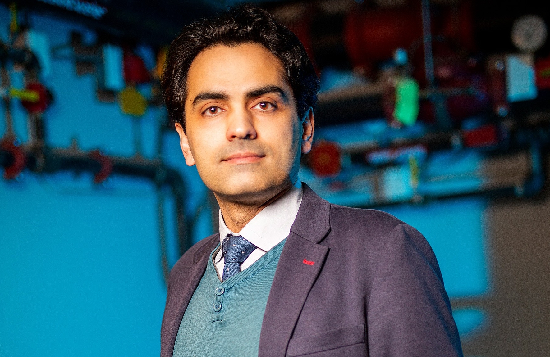 Fuzhan Nasiri Fuzhan Nasiri wears a purple jacket and blue sweater