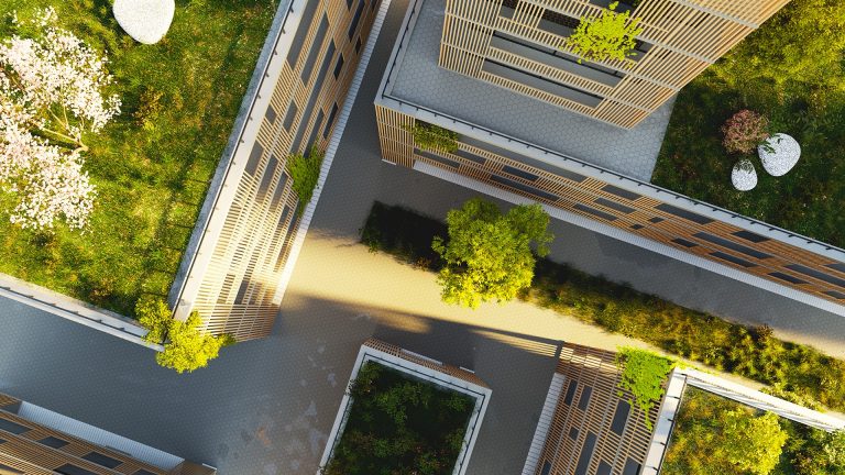 Aerial view of an empty city street with greenery on the roofs.