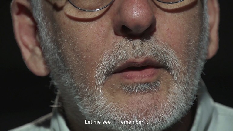 Photo of the lower part of a man's face with a white/grey beard and a text on top of the image, "Let me see if I remember..."