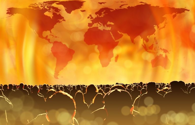 Graphic representation of a world map which looks to be on fire, with silhouetted people in the bottom foreground.