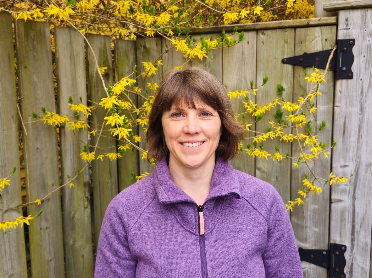Kyleisha Foote A woman wears a purple sweater