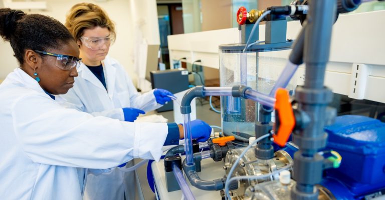 Two women working in a chemical lab