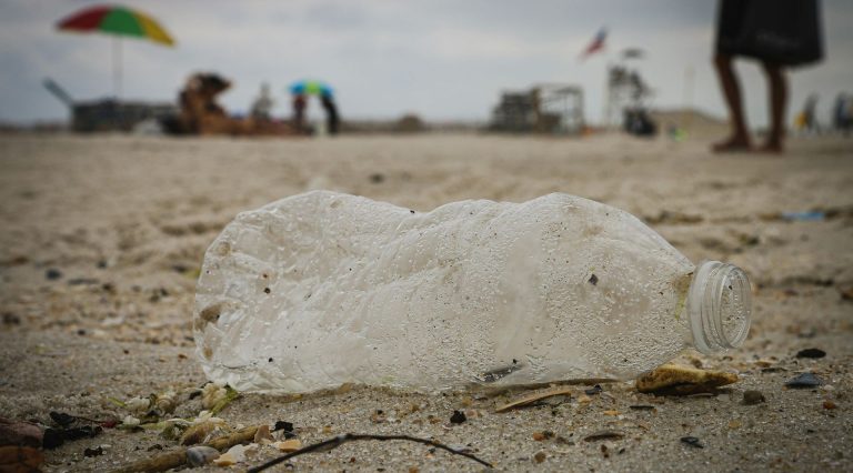 A plastic bottle on a beach