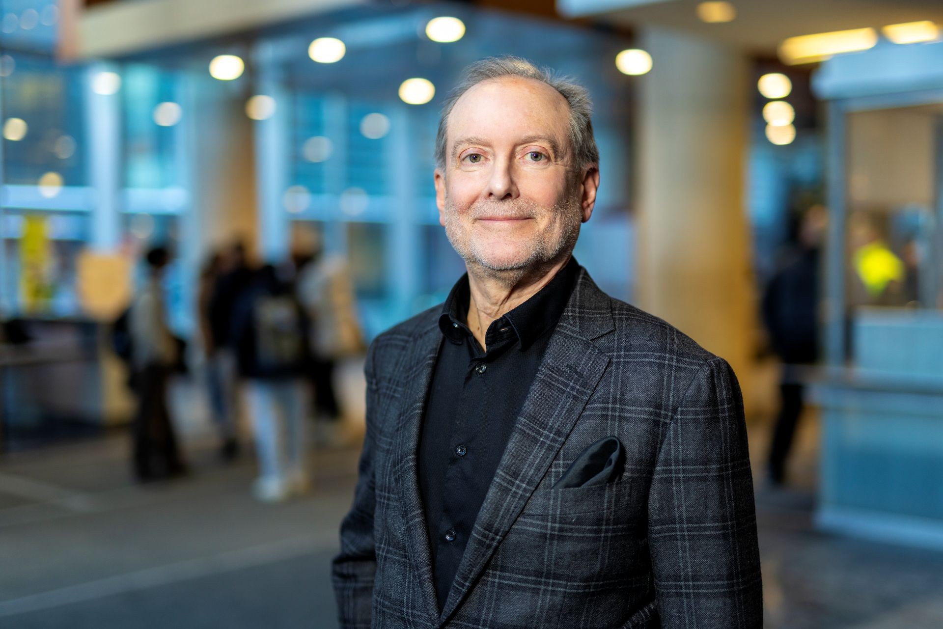 A man in a blue shirt and suit