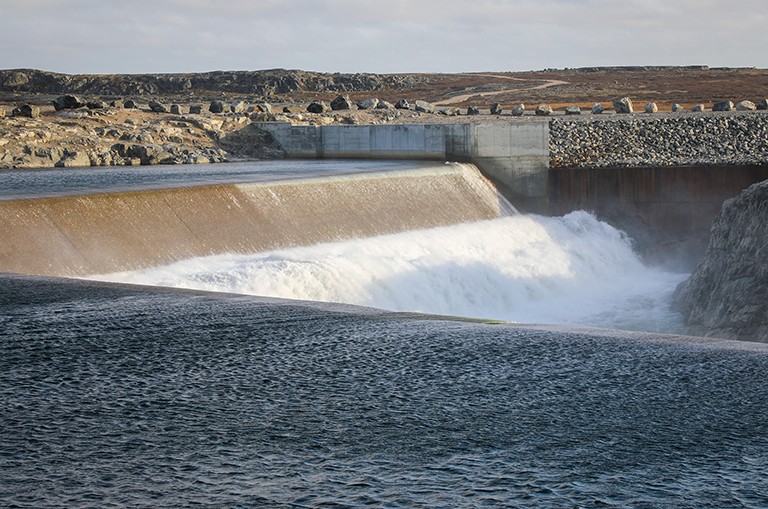 A large dam filled with rushing water
